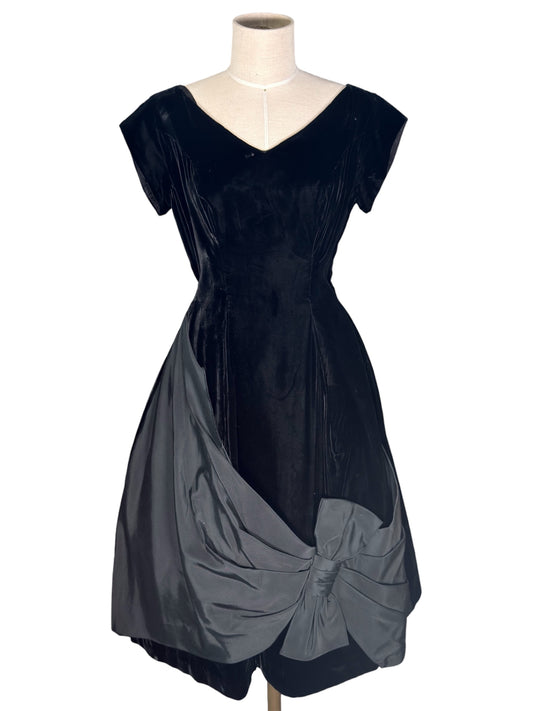 1950s Sophisticated Miss California Black Velvet Cocktail Dress With Dramatic Bow